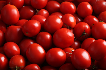Fresh red tomatoes background, close up