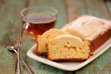 Classic cake of cup of tea on old painted planks