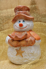 Snowman on the golden background