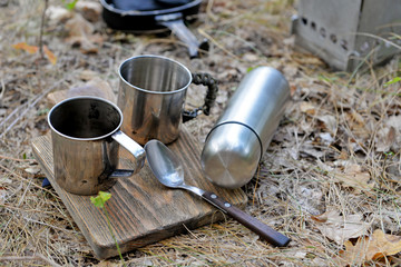 Metal dish for tourism on the ground in forest