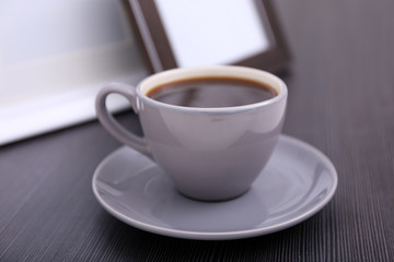 Cup of coffee on commode in room