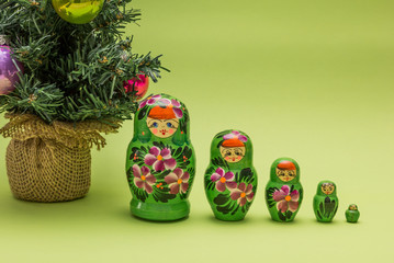 Russian wooden dolls and a Christmas tree