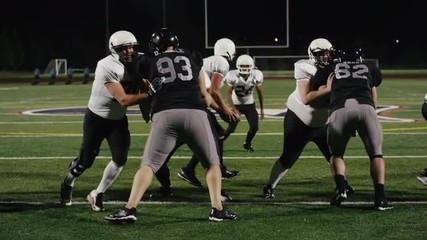 A football player runs down the field and catches the ball and makes a touchdown - Powered by Adobe