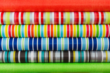 Colored rolled paper for wrapping gifts. Colorful background