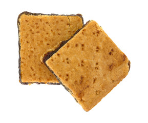 Two homemade fig bar squares on a white background
