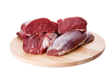 Raw beef meat and cutting board isolated on white background