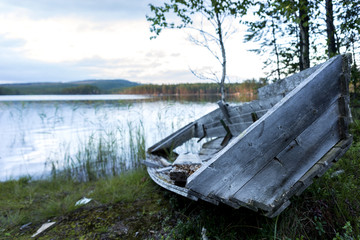 old boat by lake