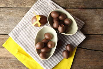 Chocolate Easter eggs on wooden background