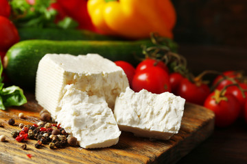 Fresh ingredients for preparing zucchini rolls on wooden background