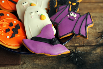 Creative Halloween cookies on wooden background