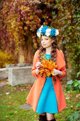 Autumn model, bright make up. woman on background fall landscape