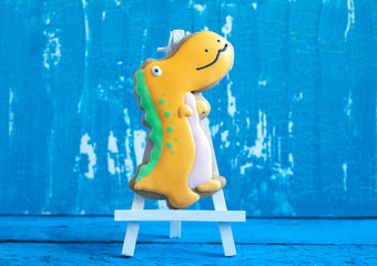 Homemade gingerbread cookie in the shape of dinosaurs 