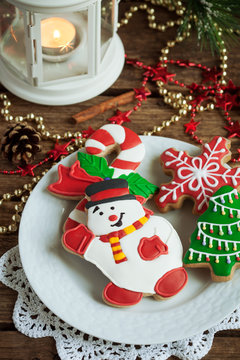 Homemade christmas gingerbreads painted as snowman, red snowflake