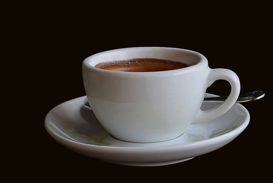Hot espresso brewed in a glass in the morning  with isolate black  background .