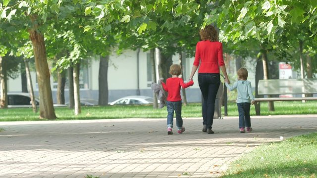 Family on a Walk in Summer. Child with mother Together