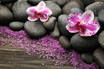 Fototapeta na wymiar Spa stones with orchid and salt closeup