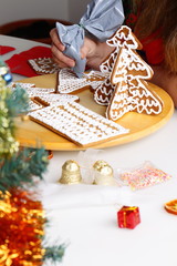 Decorating gingerbread cookies.