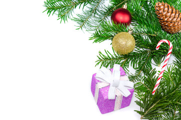Winter time. Christmas decoration with fir branches, pine cone and Christmas ornaments on white background