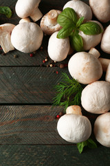 Fresh mushrooms on wooden background