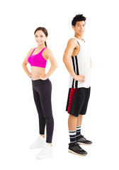 young fitness couple standing together isolated on  white