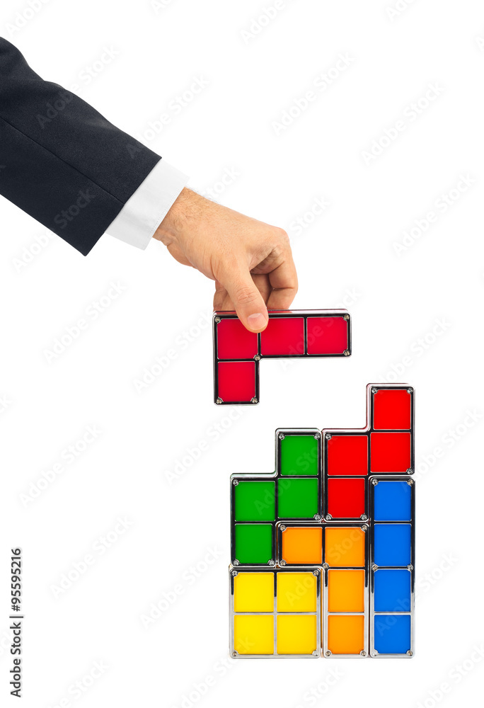 Wall mural Hand with tetris toy blocks