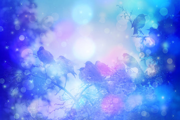 Obraz na płótnie Canvas Dreamy winter scene with starling birds sittin on the tree branches in the garden