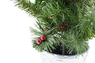 artificial green christmas tree with red cherry isolated on white background