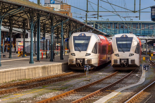 Two modern passenger commuter lightrail trains waiting at Gronin