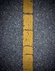 yellow line sign on road