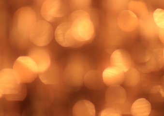 Festive gold background with bokeh effect