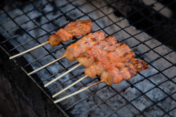 Grilled pork  on the grill. - thai food
