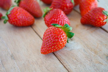 Fresh strawberries on wooden table