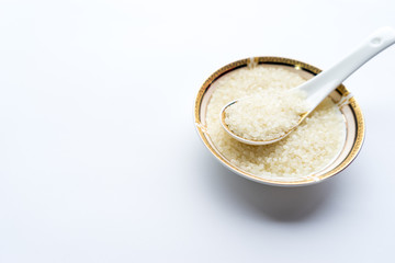 Organic white rice on the Asian spoon