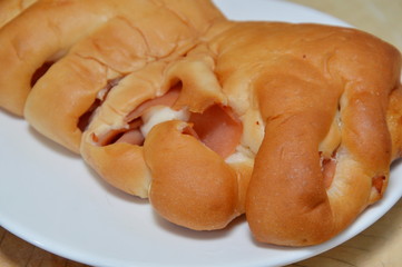 bread filled ham and cheese on dish