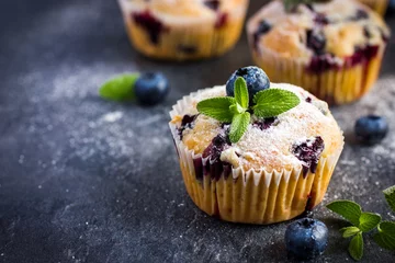 Zelfklevend Fotobehang Blueberry muffins with powdered sugar and fresh berry © anna_shepulova