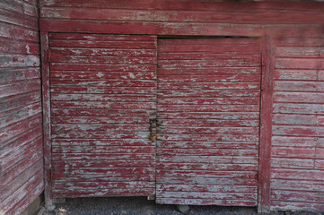 barn doors on side of old red barn