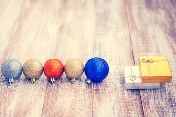 christmas balls isolated on a wooden background
