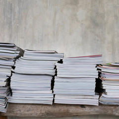 magazines on table book shelf with cement mortar wall