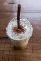 ice coffee drink on wooden table, coffee break in cafe