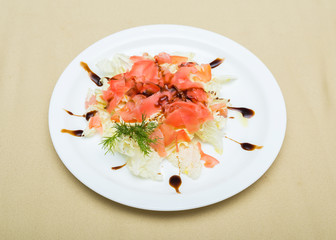 Vegetable salad with sauce (focus is in the middle of the dish)