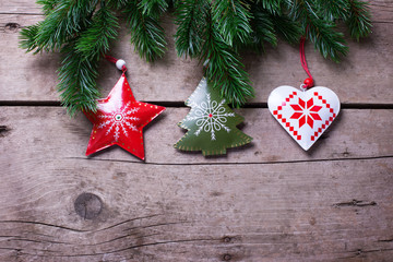 Spruce branches  and Christmas decorations on  vintage  wooden b