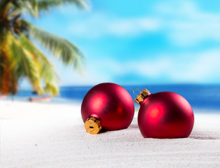 Christmas ornament on a beach,concept of a warm, tropical weather Christmas