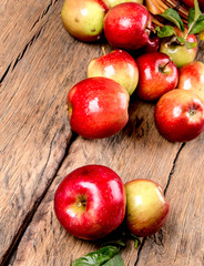 Apples on wooden background. Fresh fruits, organic product, garden concept