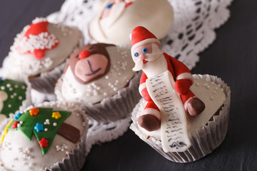 delicious cupcakes with Christmas decorations close-up. Horizontal
