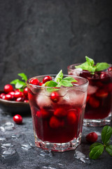 refreshing cocktail with cranberry and ice, selective focus