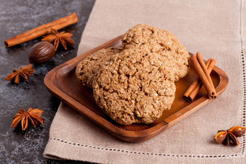 cookies and spices on a wooden plate, horizontal