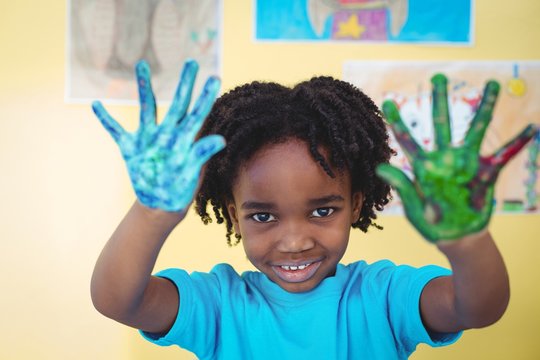 Smiling Kid Holding Up His Hands