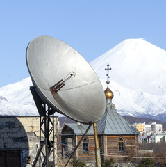 Locator and the temple against a volcano on Kamchatka