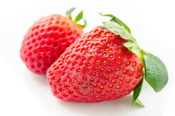 Fresh strawberries on white.