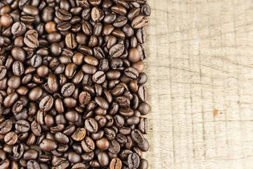 Coffee beans on wood background